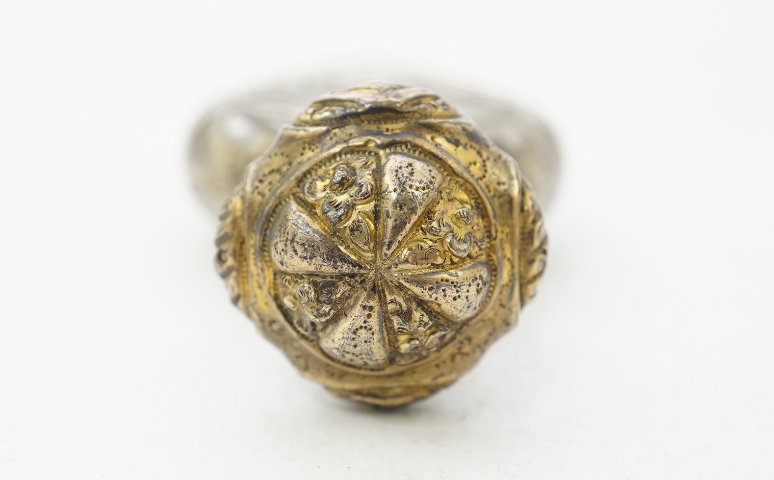 A late 19th century French parcel gilt white metal mounted and overlaid glass scent flask, with hinged cover and glass stopper